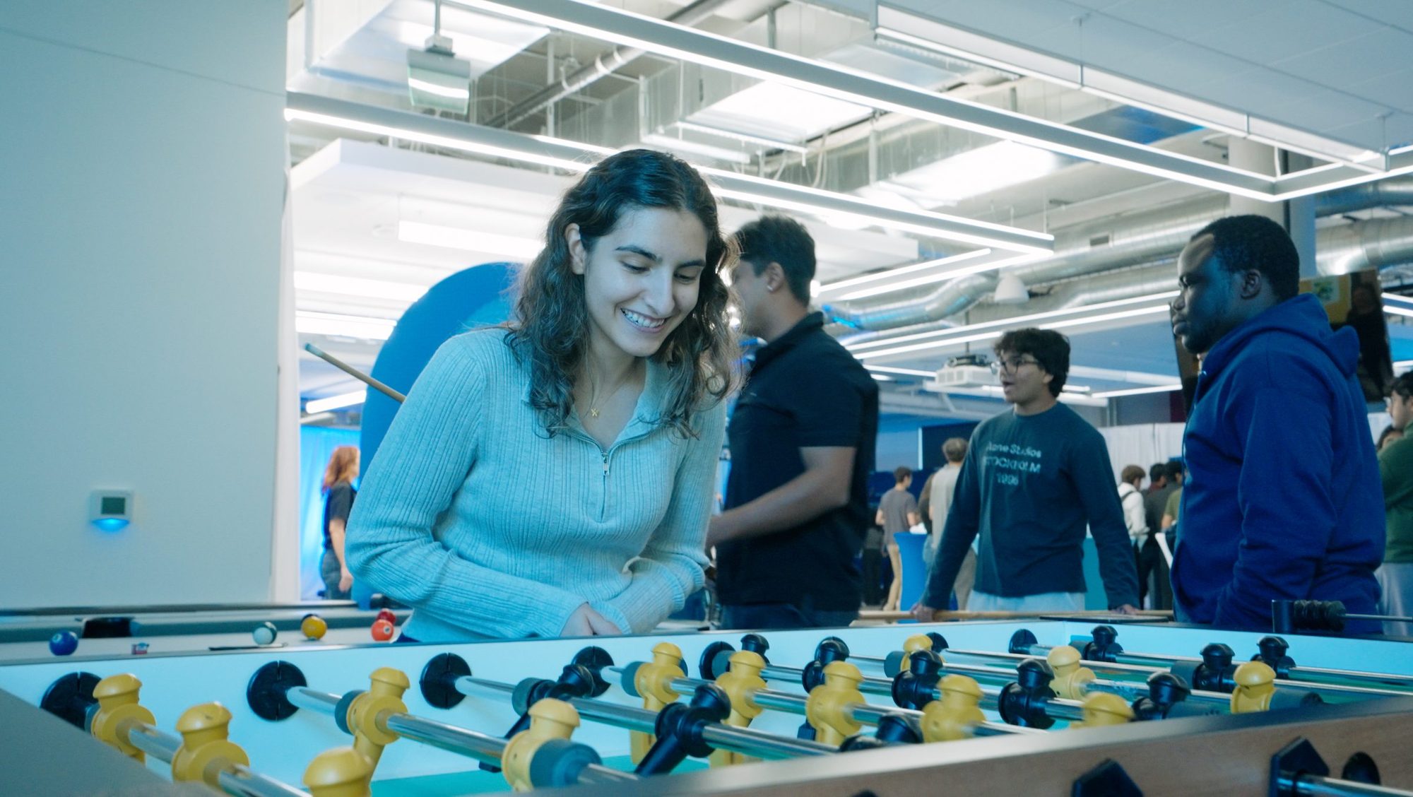 Participants playing foosball at the celebration